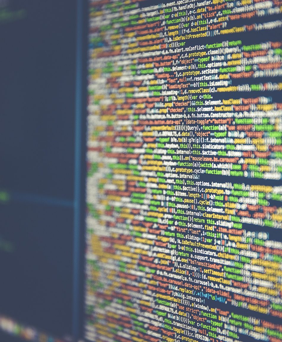Close-up of colorful source code on a computer monitor